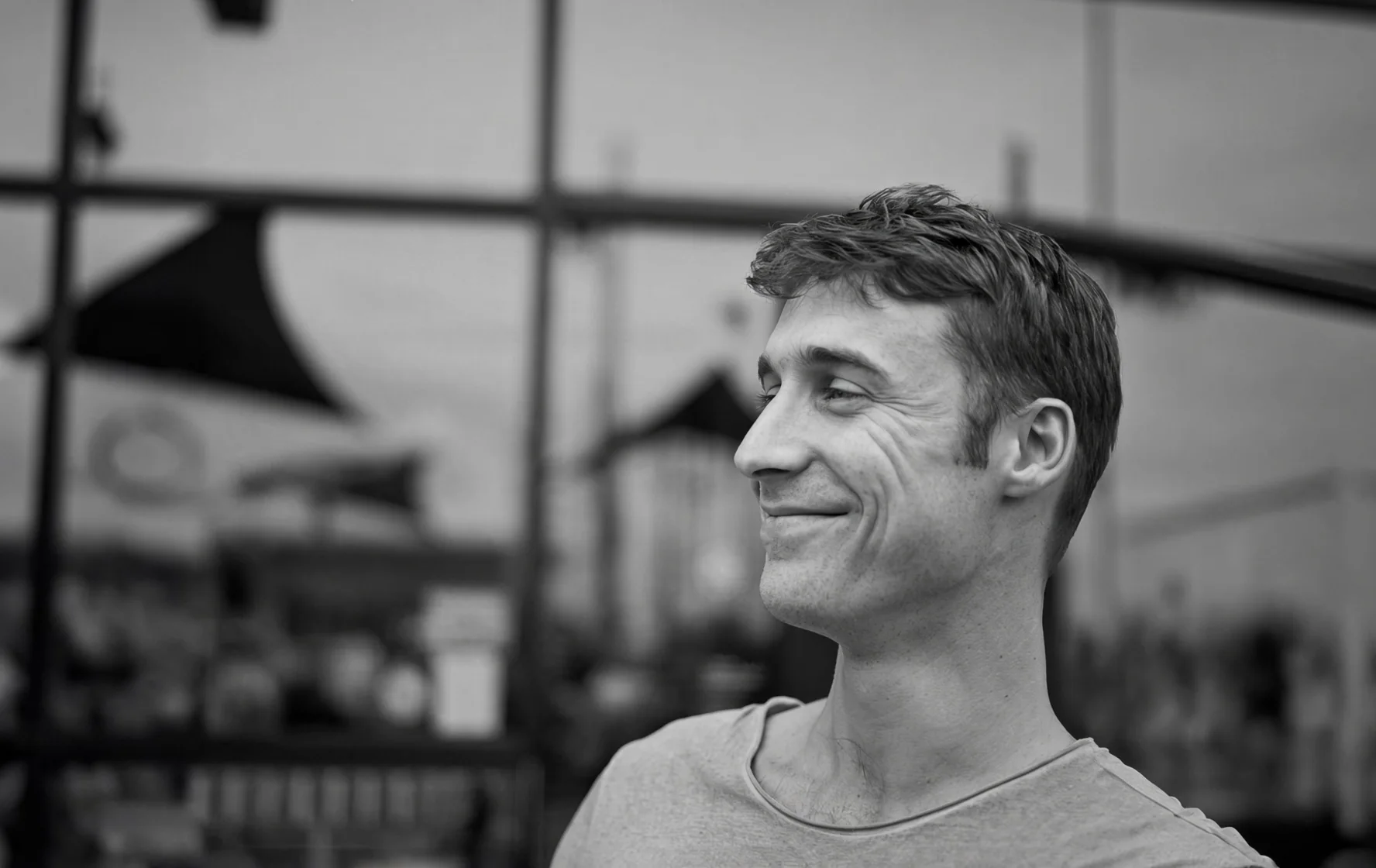 Chris Hayden, smiling, in black and white